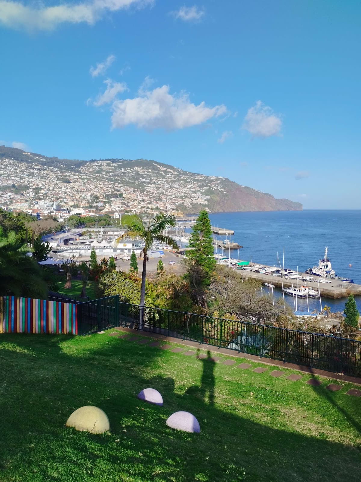 View of Funchal marina and coastline from gardens in the hotel zone