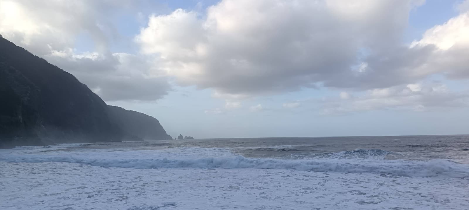 Waves breaking along a rocky north-coast shoreline at Ribeira da Janela, Madeira